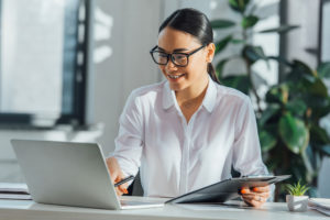 smiling translator working on document