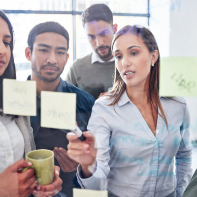 Together well go far. a team of businesspeople brainstorming together.