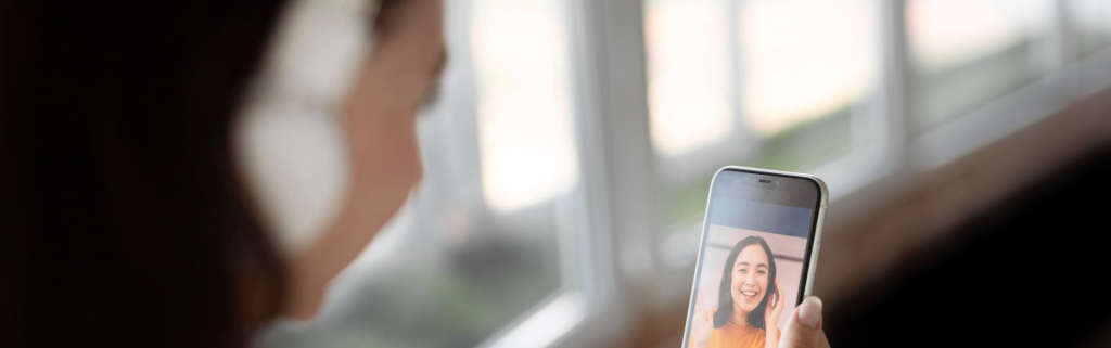 Blurry photo of a woman on a video call.